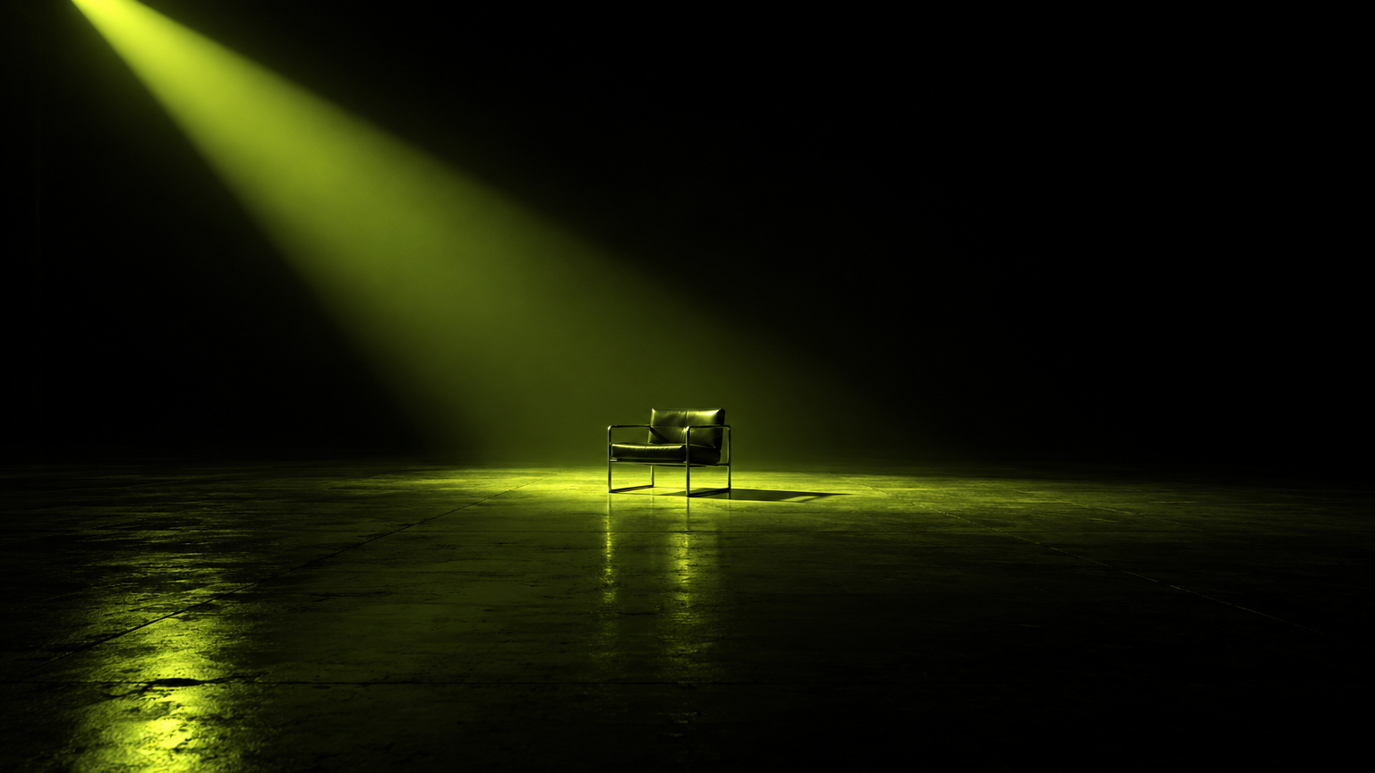 An empty soundstage under a lime spotlight